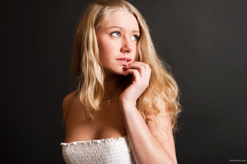 woman in white top looking up