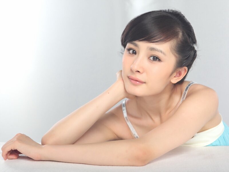 woman in white top lying down