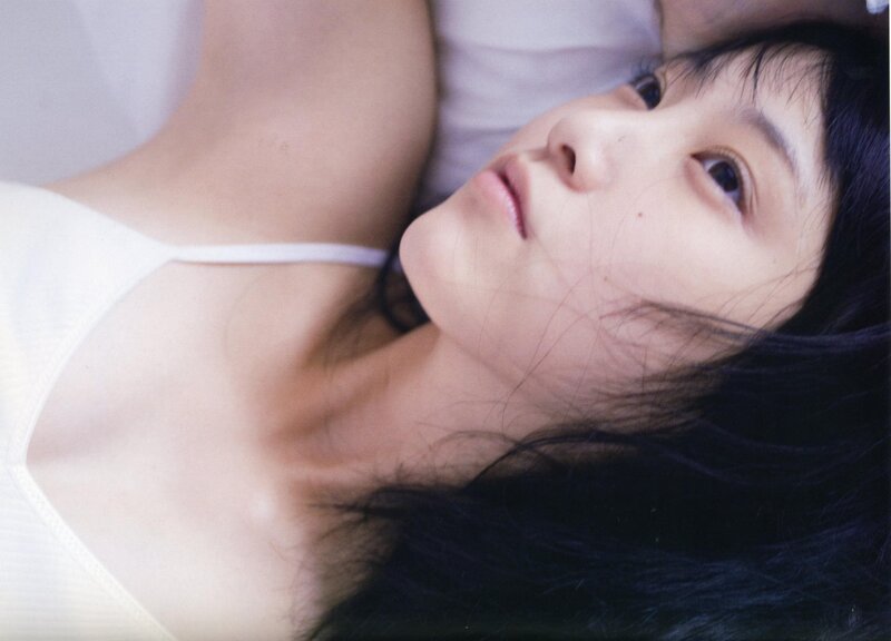 woman in white top lying down