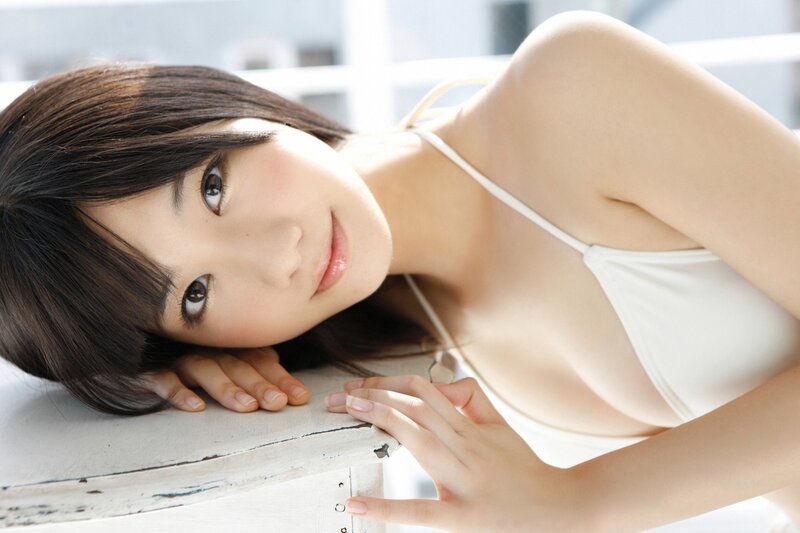 woman in white top lying down
