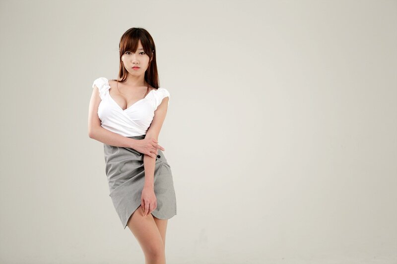 Woman in White Top — Neutral, Photograph, Skirt, Studio Background