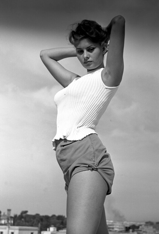 woman in white top on rooftop