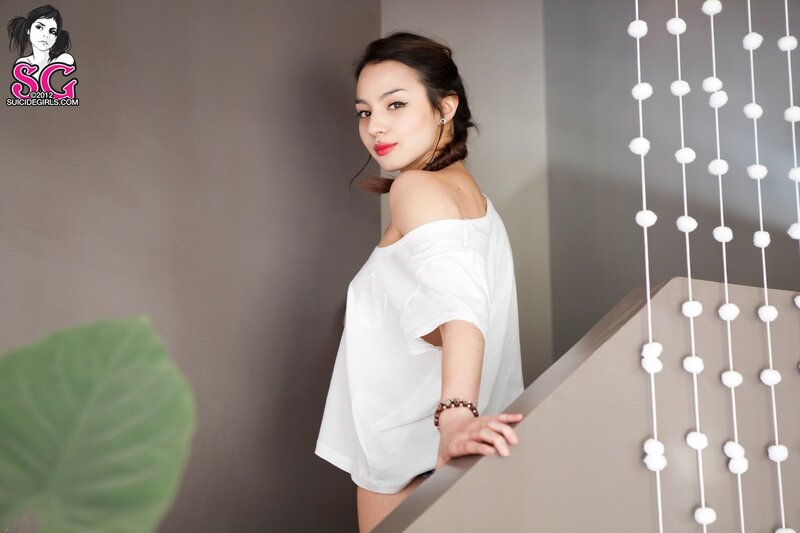 woman in white top on staircase