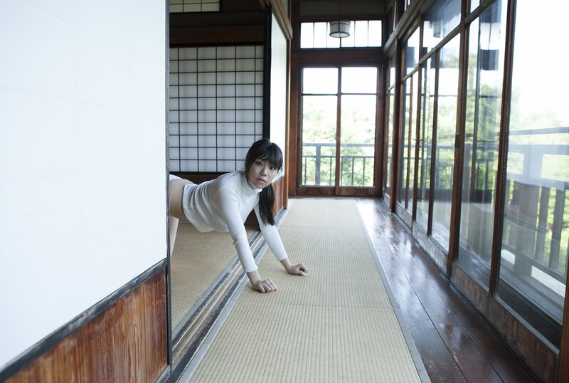 Woman in white top on tatami mat