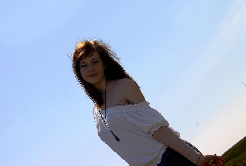 woman in white top outdoors