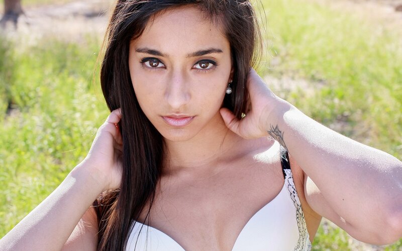woman in white top outdoors