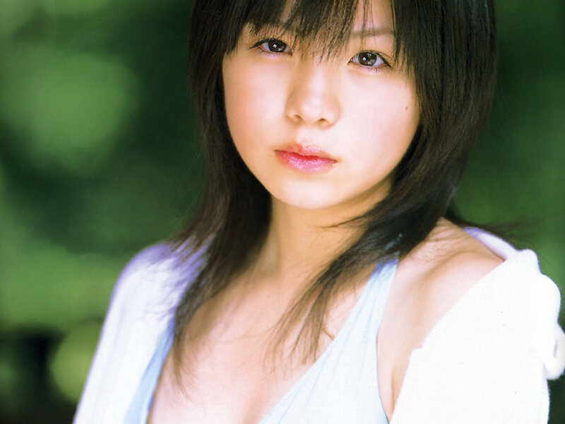 woman in white top outdoors