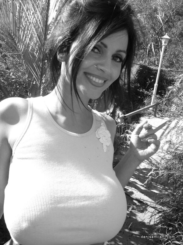 woman in white top outdoors