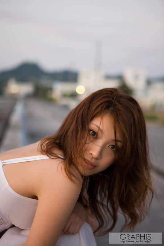 woman in white top outdoors