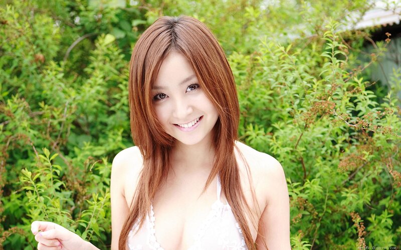woman in white top outdoors