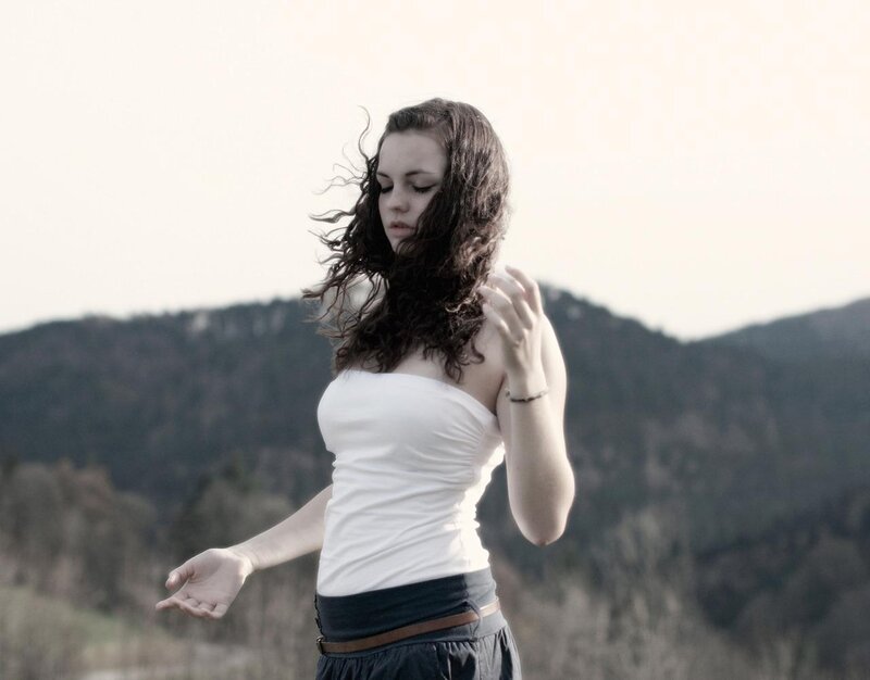 woman in white top outdoors