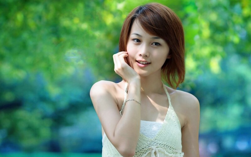 woman in white top outdoors