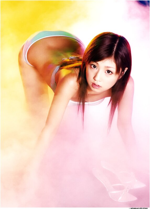 woman in white top posing