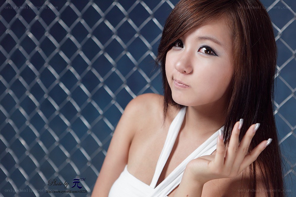 woman in white top posing
