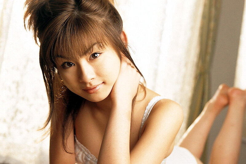 woman in white top posing