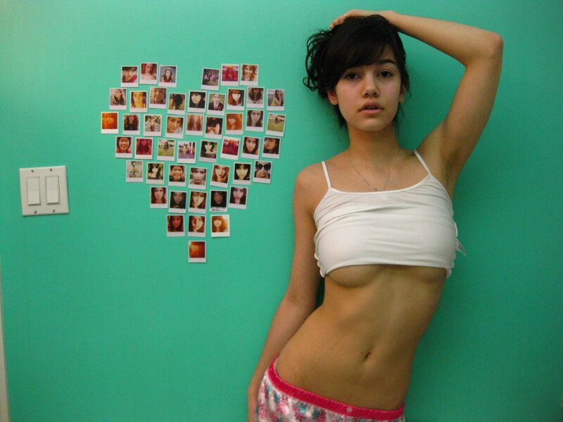 woman in white top posing