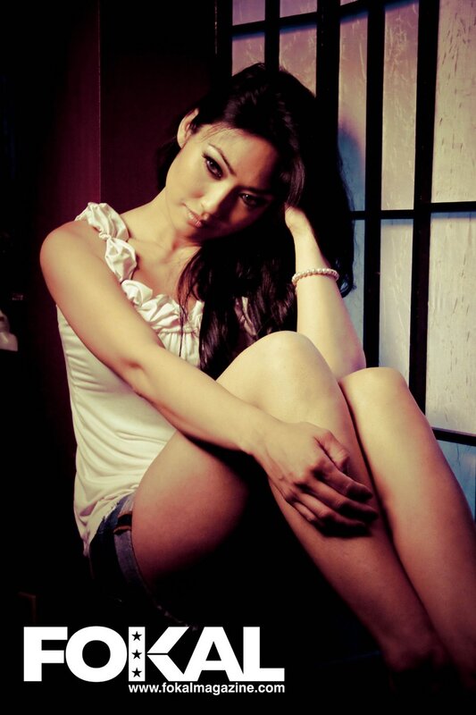 woman in white top sitting