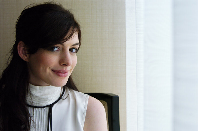 woman in white top smiling