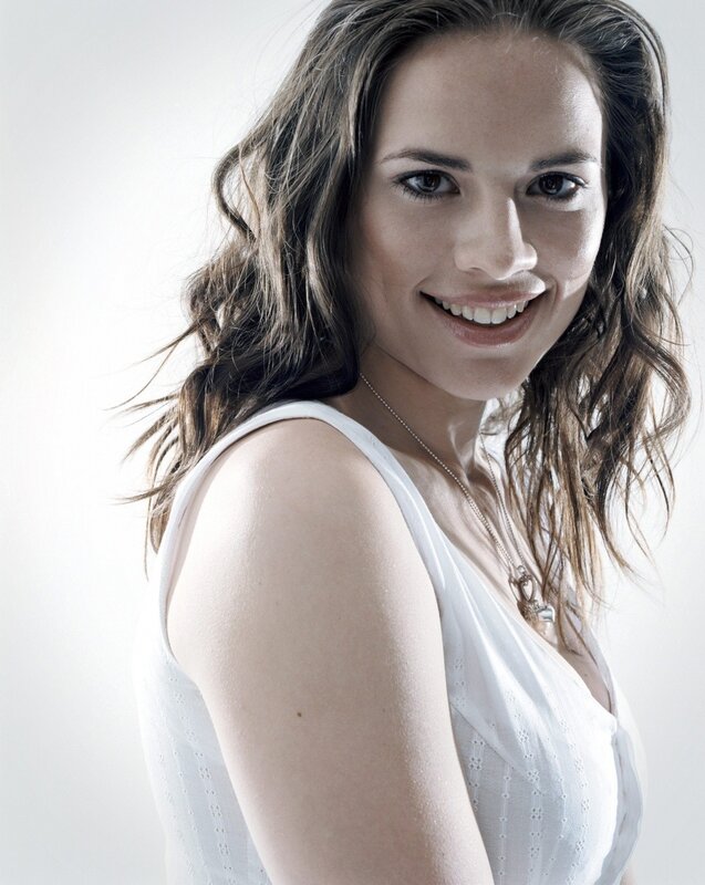 woman in white top smiling