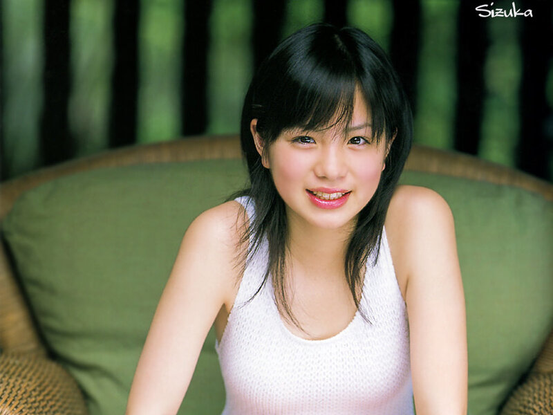 woman in white top smiling