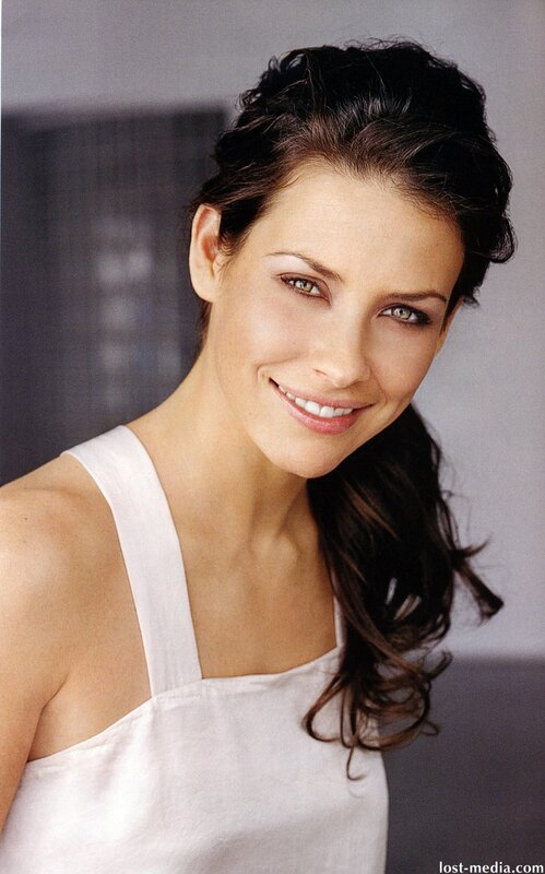 woman in white top smiling