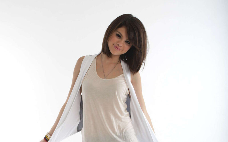 woman in white top smiling