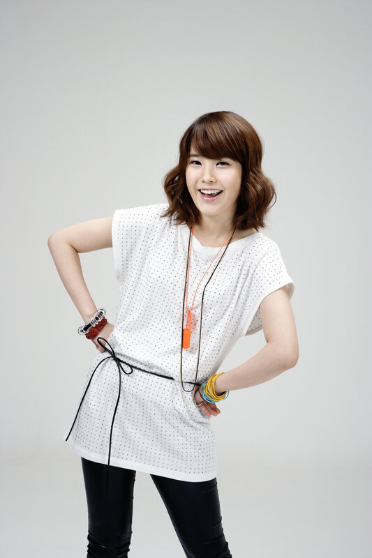 woman in white top smiling