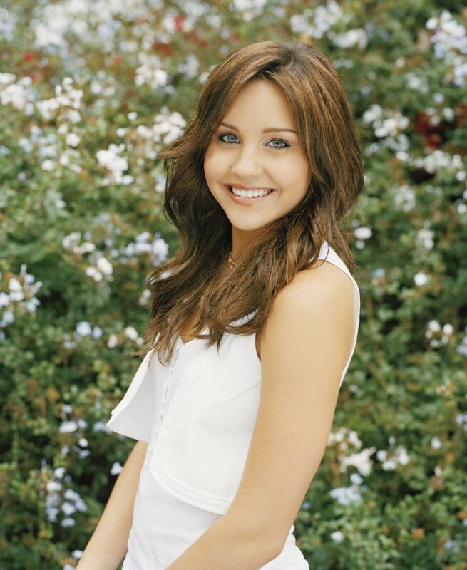 woman in white top smiling