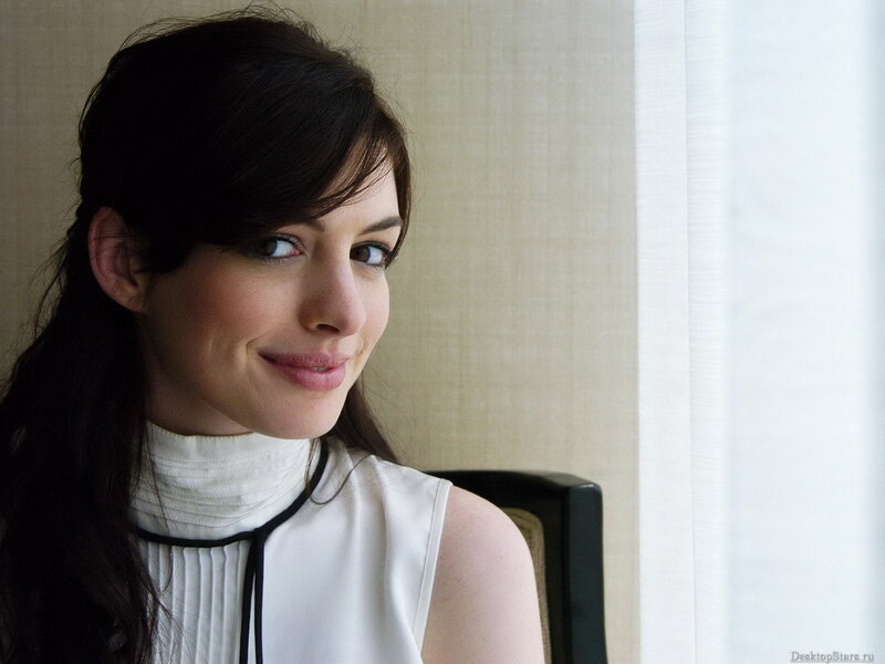 woman in white top smiling