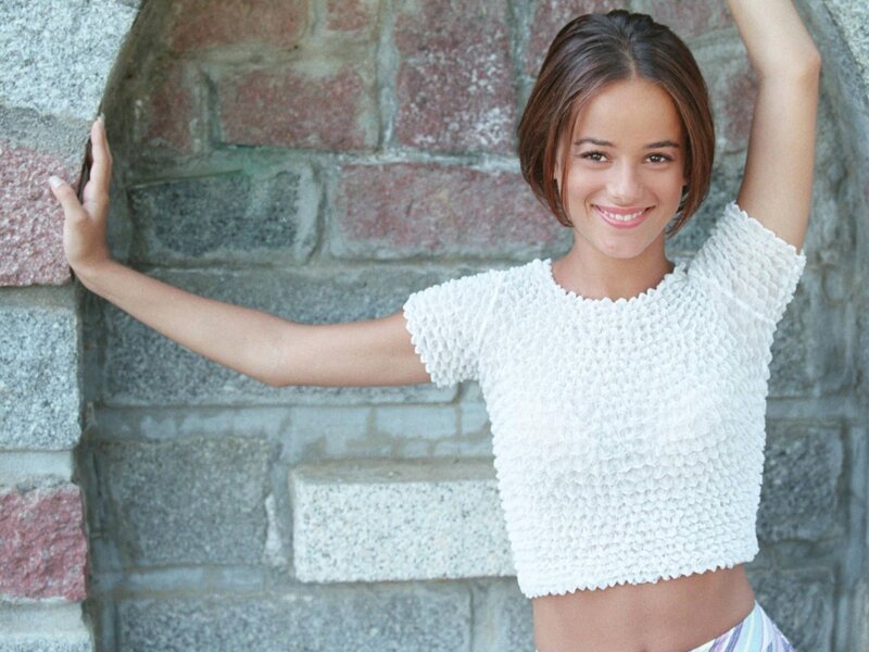 woman in white top smiling