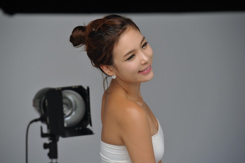 woman in white top smiling
