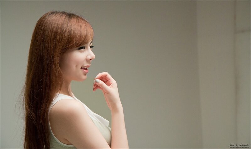 woman in white top smiling