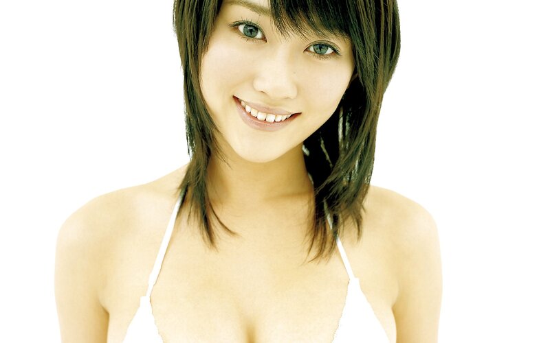 woman in white top smiling