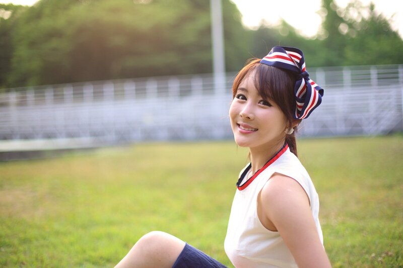 woman in white top smiling
