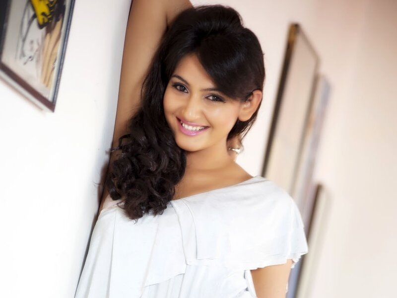 woman in white top smiling
