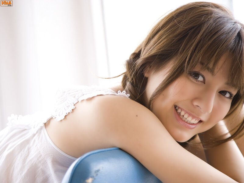 woman in white top smiling