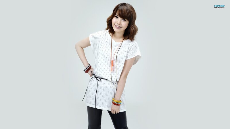 woman in white top smiling