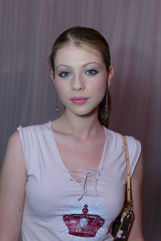 woman in white top with crown design