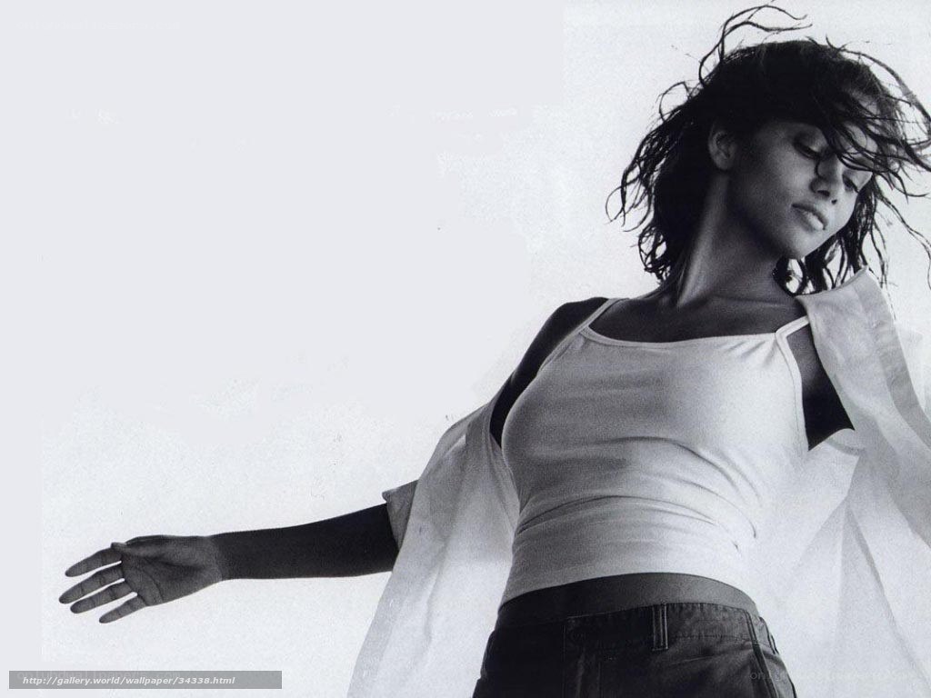 woman in white top with flowing hair
