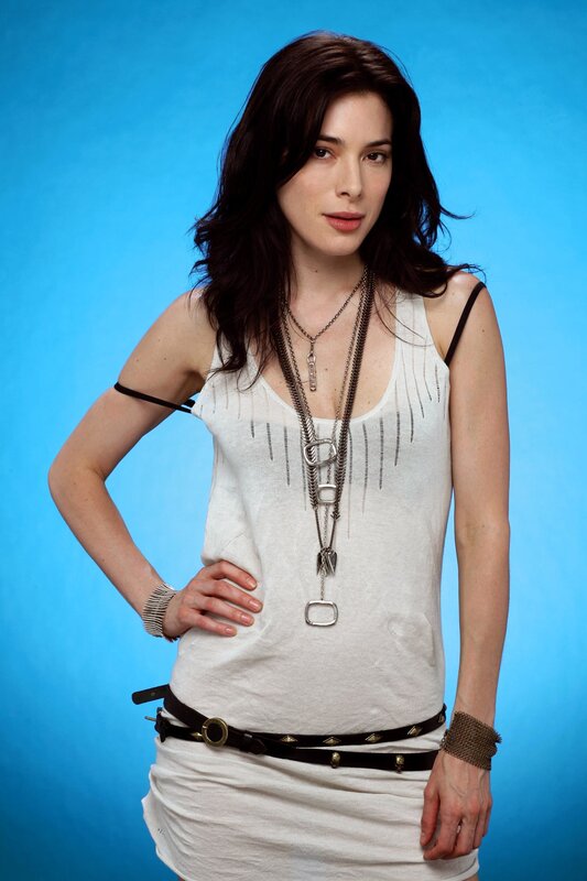 woman in white top with necklaces