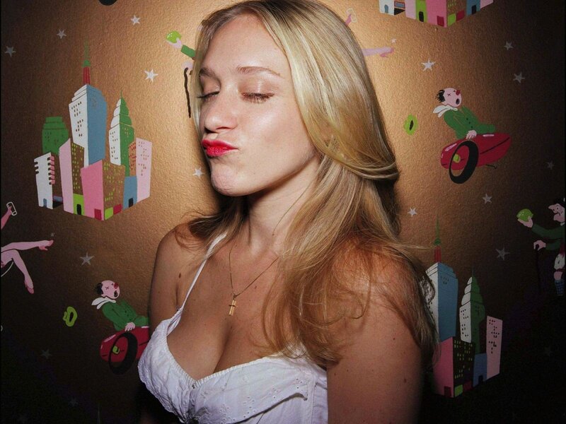 woman in white top with red lipstick