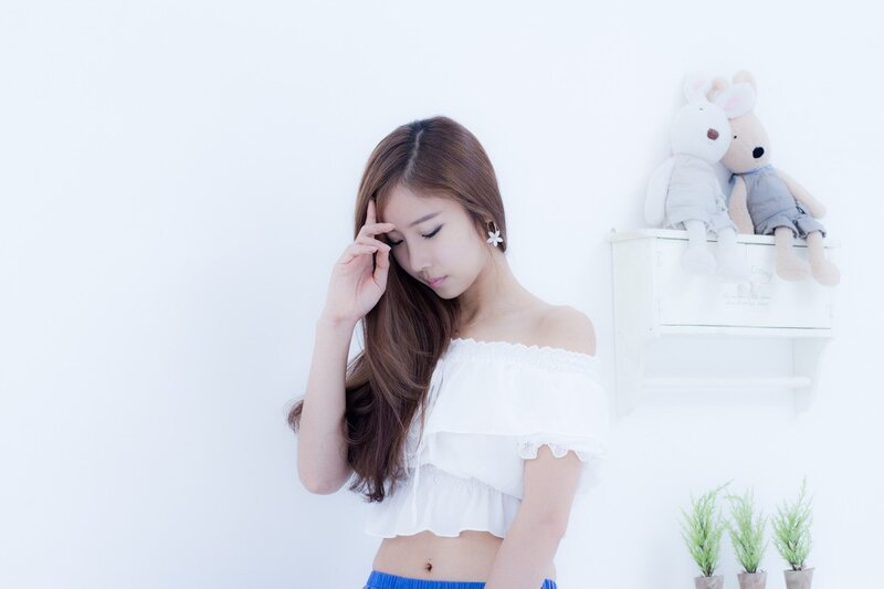 woman in white top with stuffed animals