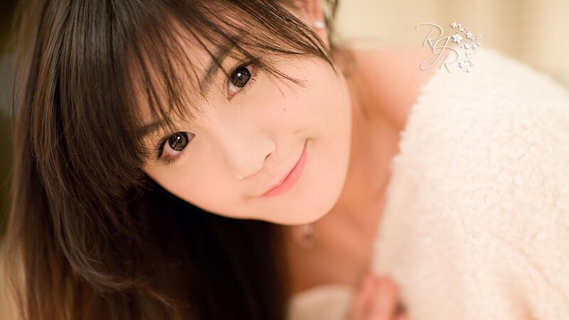 woman in white towel smiling