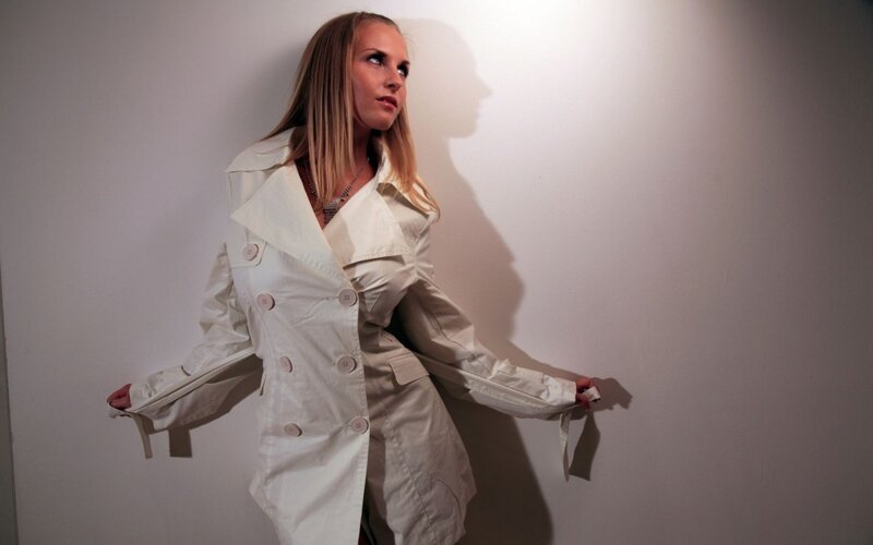 Woman in White Trench Coat — Dramatic