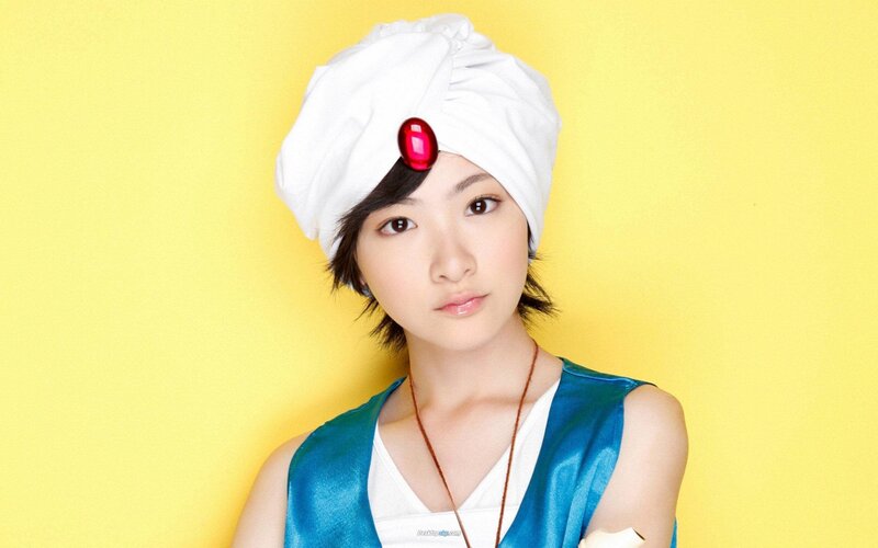 woman in white turban with red gem