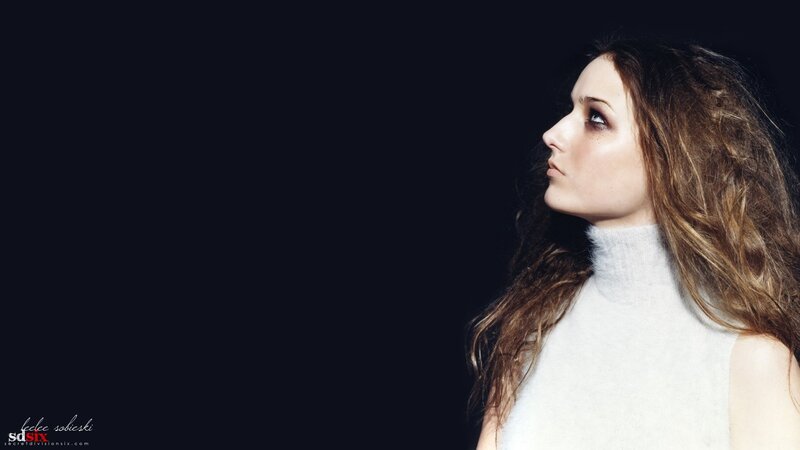 woman in white turtleneck
