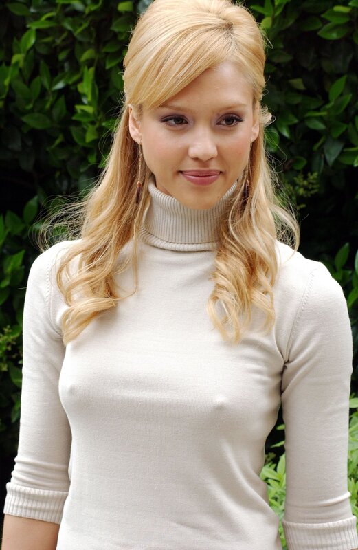 woman in white turtleneck