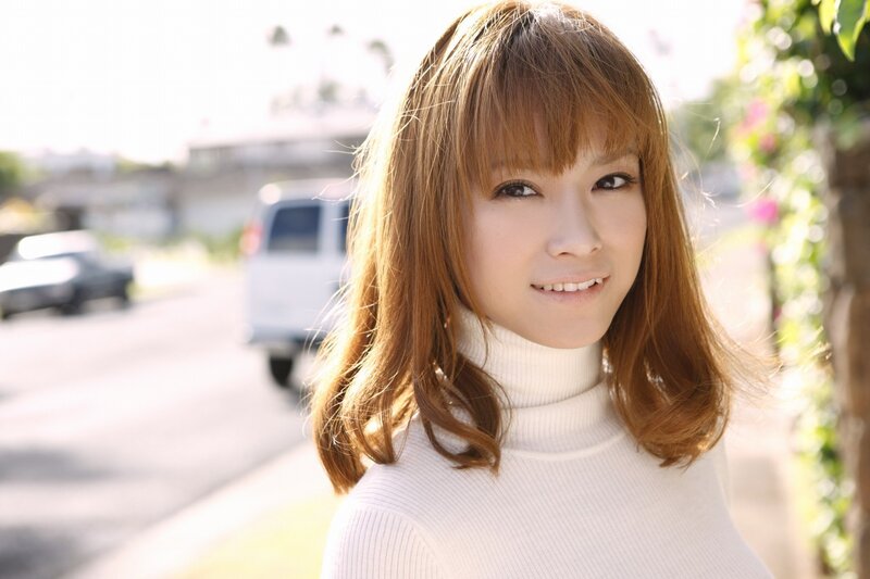 woman in white turtleneck