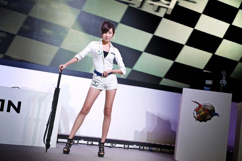 woman in white uniform on stage