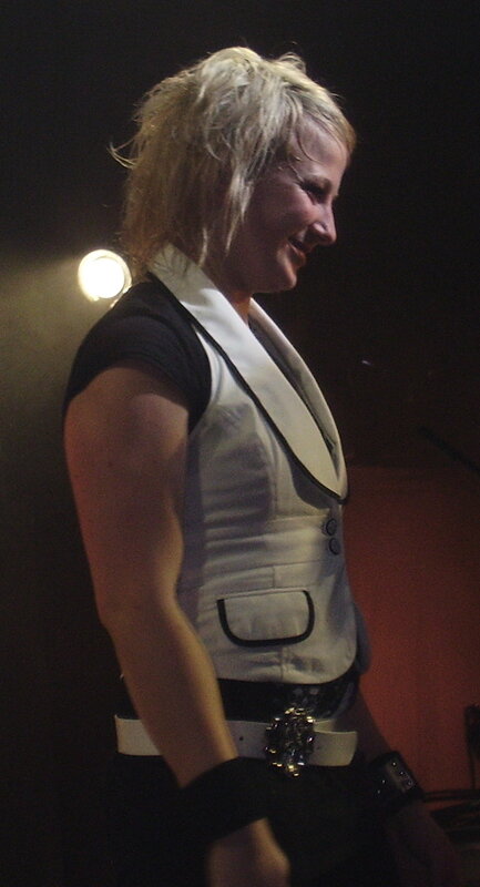 woman in white vest smiling